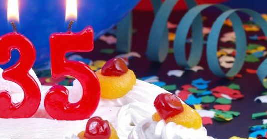 A birthday cake with number 35 candles on top
