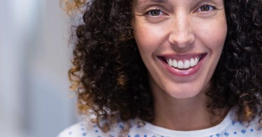 A woman smiling
