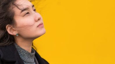 A woman staring away with sadly