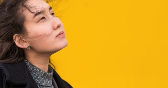 A woman staring away with sadly