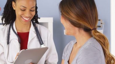 A woman speaking with her doctor
