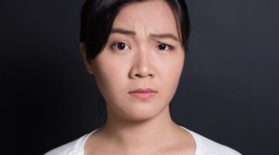A woman with a confused look on her face