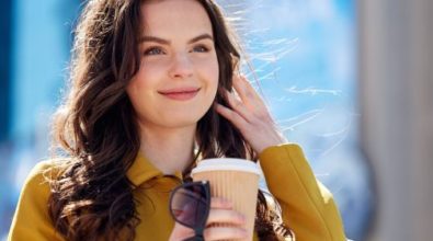 A woman drinking a coffee