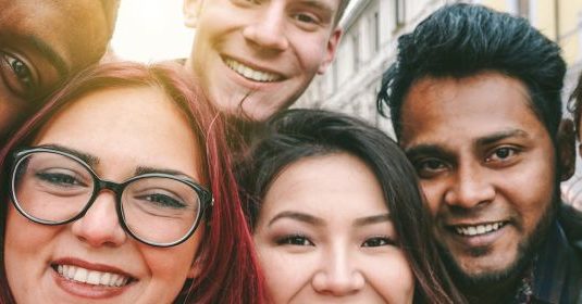 A group of people smiling for a picture